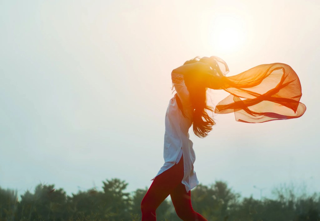 woman with orange scarf